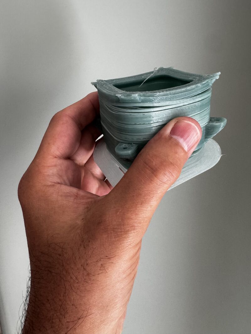 Warped recycled nylon 6 3D printed part showing layer adhesion and internal stress issues